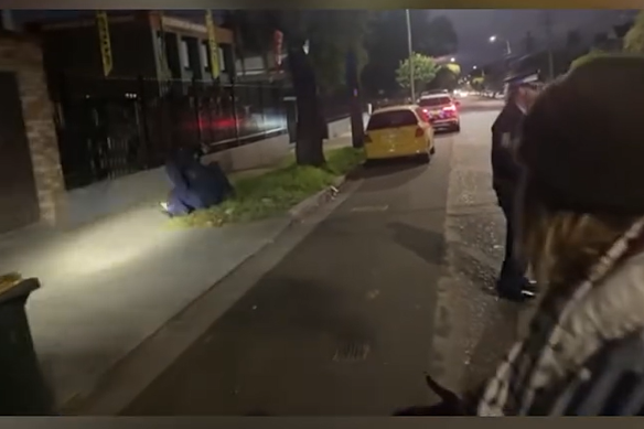 A screengrab from video posted to Instagram that was filmed during an altercation between NSW Police and protesters at a picketing of a business in Belmore on Friday. 
