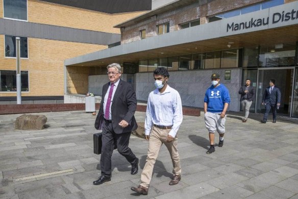 Yuvaraj Krishnan and his lawyer at the Auckland court.  