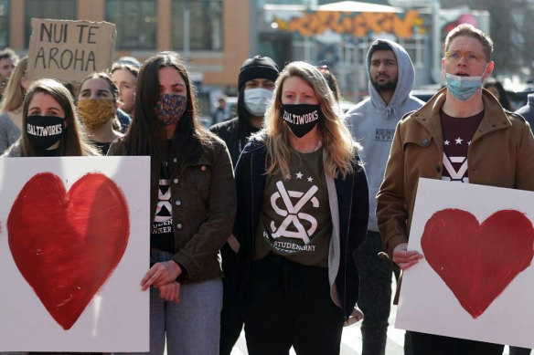 The Student Volunteer Army members sing outside court in support of victims as Christchurch mosque gunman Brenton Tarrant is sentenced. 