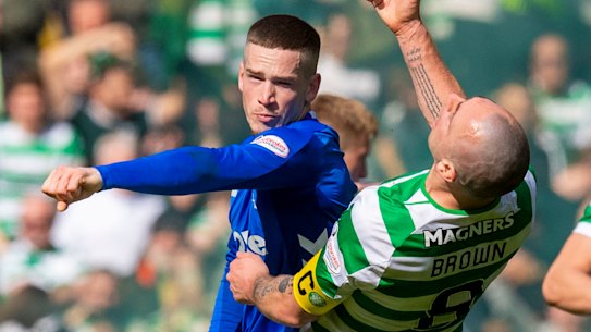 Rangers’ Ryan Kent clashes with Celtic’s Scott Brown during a combustible Old Firm derby in 2019.