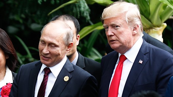 Russian President Vladimir Putin and Donald Trump arrive for the 'family photo' at the APEC forum last year.