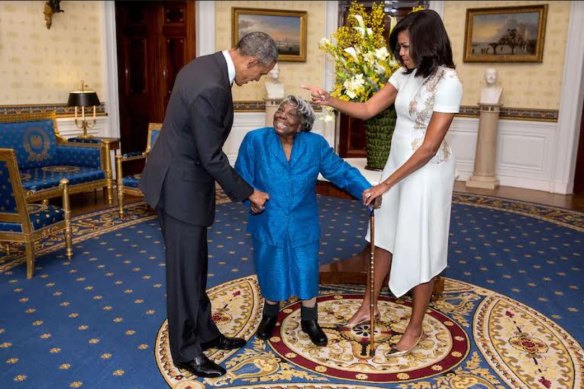 Then president Barack Obama and first lady Michelle Obama greet 106-year-old Virginia McLaurin at the White House in 2016.