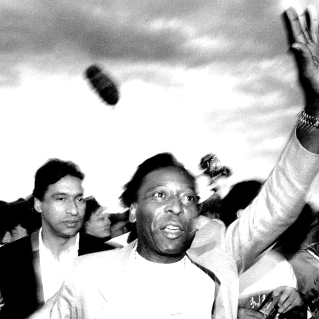 Pele is welcomed by fans at St George Stadium in 1990.