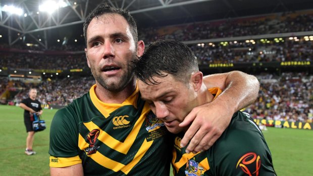 Better days: Smith and Cronk celebrate a Kangaroos' win in 2017. 