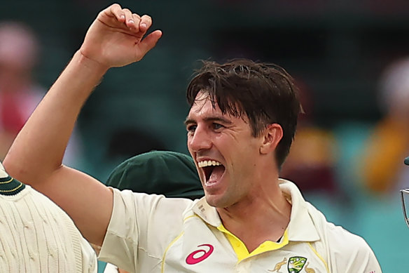 Cummins celebrates his third wicket of the day.