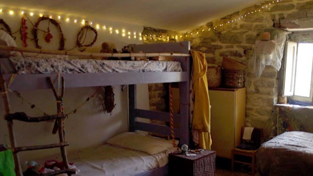 All five members of the family share a bedroom in this off-the-grid home.