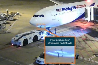CCTV shows the pitot probe covers on the Malaysia Airlines plane prior to take-off.