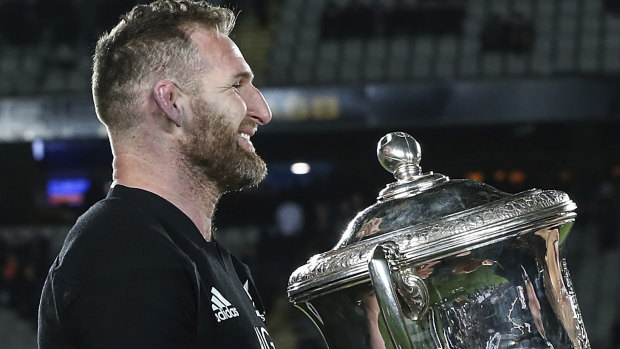 Safe for another year: Kieran Read receives the Bledisloe Cup from New Zealand Prime Minister Jacinda Ardern.