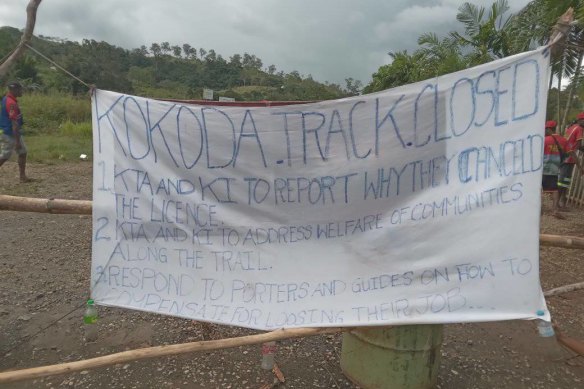 A sign by porters closing the Kokoda Trek.