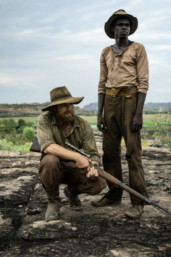 Simon Baker as Travis and Jacob Junior Nayinggul as the adult Gutjuk.