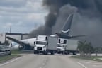 A cargo plane overshot the runway and crashed onto a road at Miami International Airport.