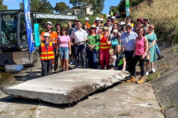 Friends of Moonee Ponds Creek with the first slab of concrete being removed. 