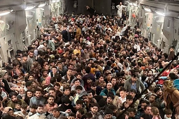 Afghan citizens packed inside a U.S. Air Force plane during the evacuation from Hamid Karzai International Airport in Afghanistan in August 2021.