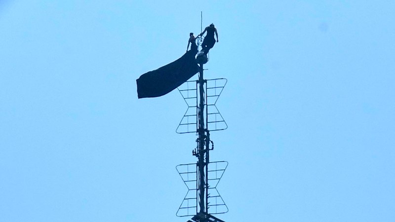 Artists Angela Nikolau and Ivan Beerkus in police custody after scaling spire for marriage proposal
