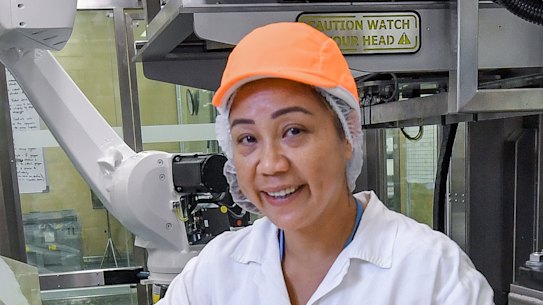 On the factory floor at Blackmores, Ruby Mongoso operates robots on the production line.