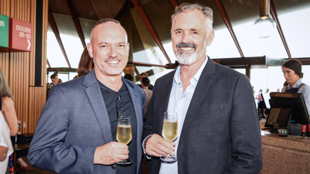 Geoffrey Jaeger and Andrew McFarlane enjoying a glass of bubbles at the Opera House on Tuesday.