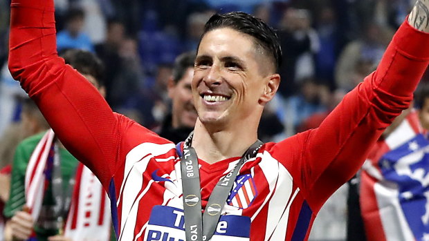 Gone to highest bidder: Fernando Torres celebrates after winning the UEFA Europa League final with Atletico Madrid\'s over Olympique Marseille in May.