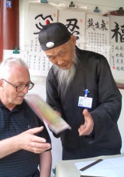 Danny Kane and an unknown calligrapher at the Summer Palace, Beijing.