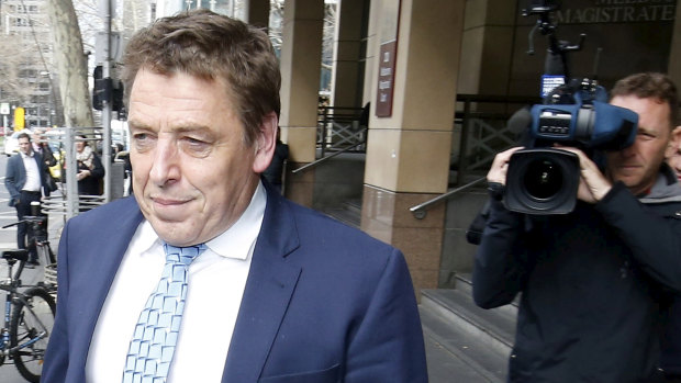 Mark 'Bomber' Thompson walks out of the Melbourne Magistrates Court on Tuesday.