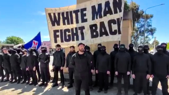 The men, believed to be part of a white supremacist group, gather in front of the Corowa war memorial.