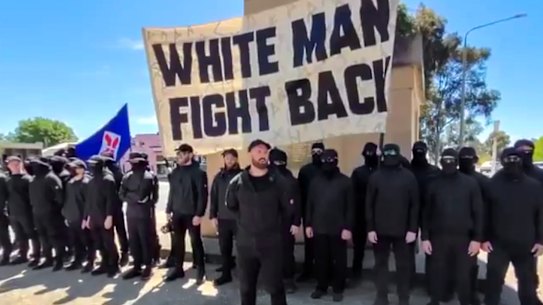 The men, believed to be part of a white supremacist group, gather in front of the Corowa war memorial.