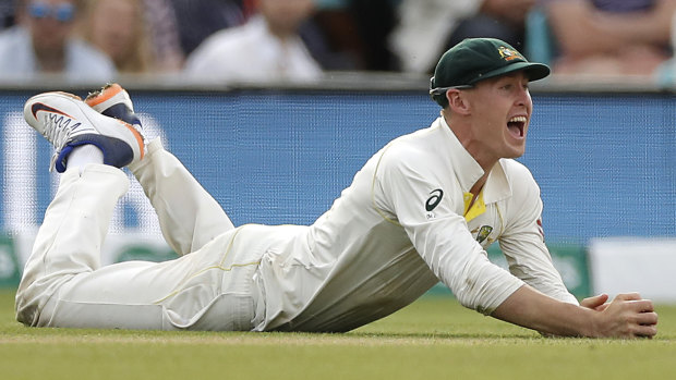 Long time in the making: Marnus Labuschagne takes a catch to dismiss Jos Buttler in the fifth Ashes Test at The Oval.