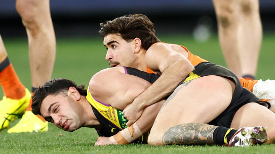Richmond’s Tim Taranto is tackled by the Giants’ Toby Bedford.