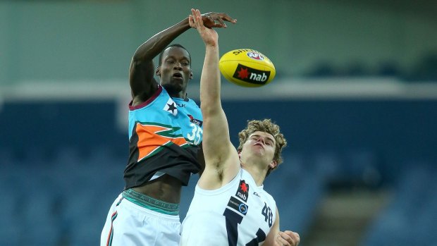 Charge: Tony Olango (left) competing in the AFL Under 18 Championships in 2016.