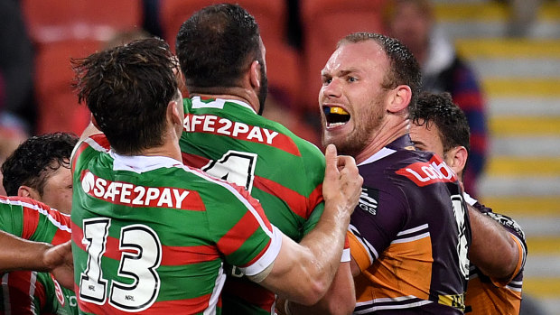 Broncos prop Matt Lodge confronts Rabbitohs players during a fiery clash at Suncorp Stadium on Friday night.