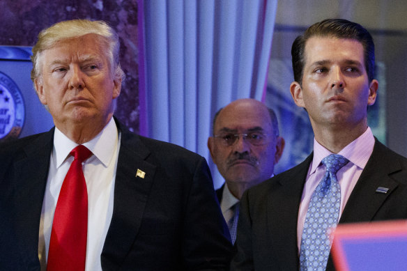 Donald Trump with son Donald jnr and CFO Allen Weisselberg (centre).