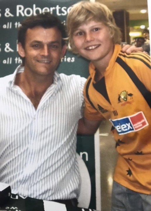 A young Will Pucovski with one of his cricketing idols, Adam Gilchrist