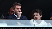Cruz Beckham attended a World Cup game with his dad David Beckham, and found a way to take a swipe at his brother Brooklyn in the process. 
