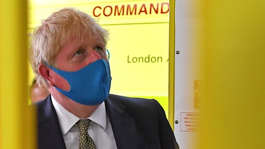 Boris Johnson wears a mask on Monday during a visit to the London Ambulance Service NHS Trust.