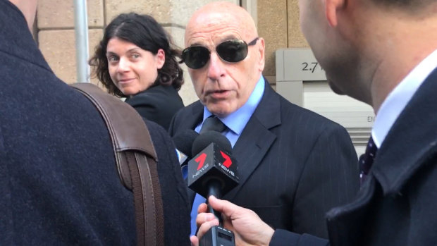 Tom Domican, outside the Federal Court in Sydney on Thursday, is attempting to serve John Ibrahim legal papers relating to a defamation action. 