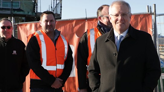 Prime Minister Scott Morrison announces the the HomeBuilder program in Googong, with Fiona Kotvojs by his side.