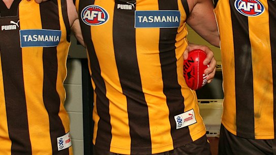 Hawthorn players celebrate their victory.