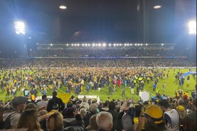 Fans invaded the pitch on the final whistle in Gosford.