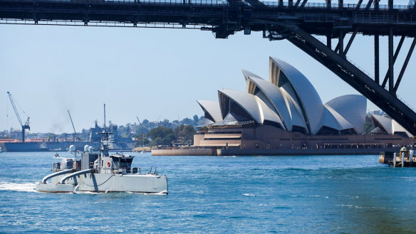 The unmanned surface vessel Sea Hunter transits underneath the Sydney Harbor bridge as part of an October training exercise. 