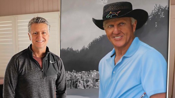 Queensland artist Tom Macbeth with his portrait of Australian golf legend Greg Norman.