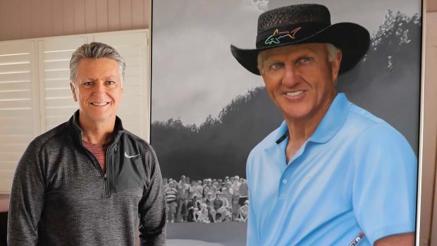 Queensland artist Tom Macbeth with his portrait of Australian golf legend Greg Norman.