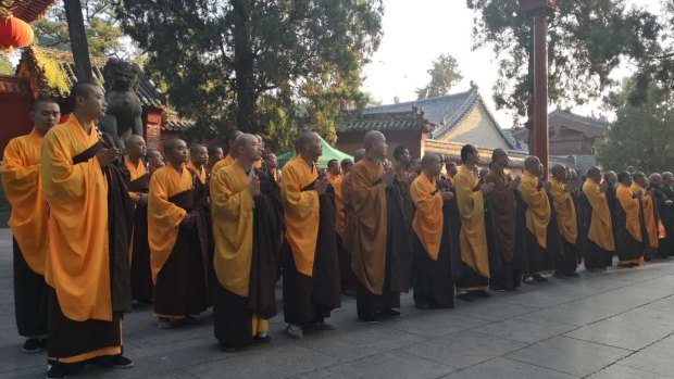 Monks attend the ceremony at the Shaolin Temple.