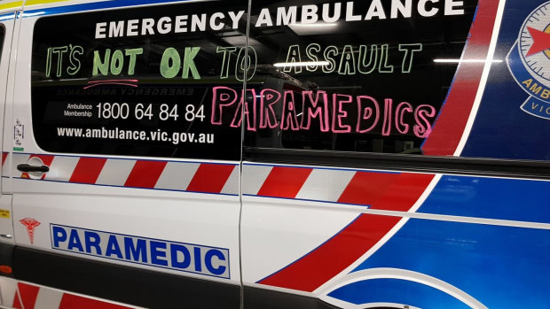 An ambulance carrying the message that it's 'not OK to assault paramedics'.
