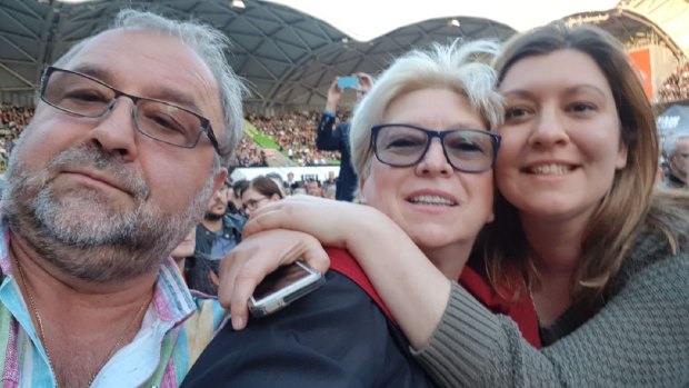 Sasha Petrova and her parents at a Paul McCartney concert in 2017.
