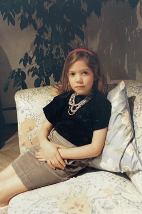 Lucy, aged 5, in  London wearing her 
mother’s jewellery. 