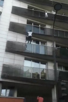 "Spiderman": Mamoudou Gassama rescues a young boy dangling from a balcony in Paris.