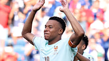 Kylian Mbappe acknowledges the crowd after France’s 2-0 win over Morocco.