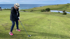 Clovelly local Cerin Campling tees off: a new generation of golfers and women has seen golf club membership up 10.2 per cent over the past three years and female membership 12.6 per cent higher last year. 