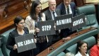 Victorian Greens MPs Gabrielle de Vietri, Ellen Sandell, Tim Read and Sam Hibbins pose with a slogan.