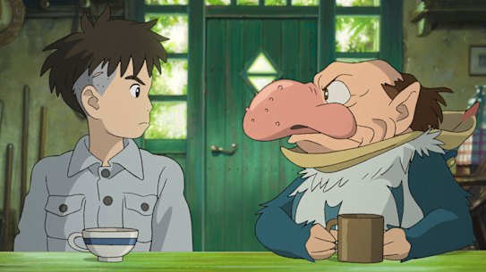 Mahito Maki (voiced by Luca Padovan) and the Grey Heron (Robert Pattinson), who entices him bidding him to enter an abandoned tower.