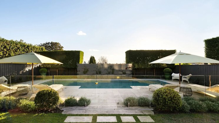 smh.com.au - Kristy Johnson - Retail boss lists $17m 'interim' home as he moves into Swans chairman's $40m abode